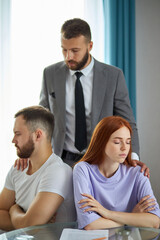 confident psychologist listen to problems of couple, try to help and give advice how to solve their problems, make peace. man and woman are offended at each other