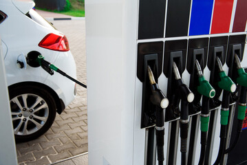 Petrol pump filling nozzles isolated on blsck background , Gas station in a service