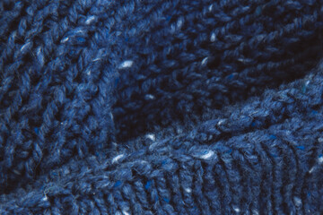 Texture beautiful knitted blue fabric as background. Copy space. Female hobby concept. Knitting