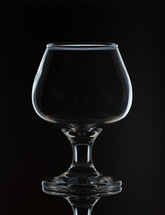 empty wineglass isolated on black background