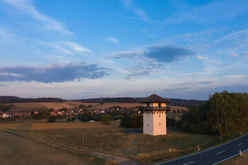 View of the replica of a Roman watchtower on the Limes near Idstein / Germany in the Taunus at sunset