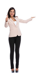 Positive businesswoman gesturing ok and inviting, smiling