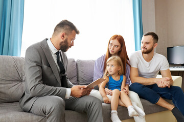 young caucasian family expain situation, problems to family psychologist. professional therapist attentively listen to them, try to help, give advices. last chance to save the family