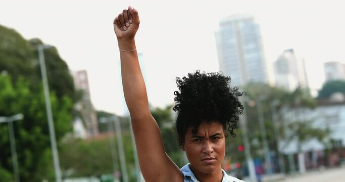 Female political activist raising fist in the air