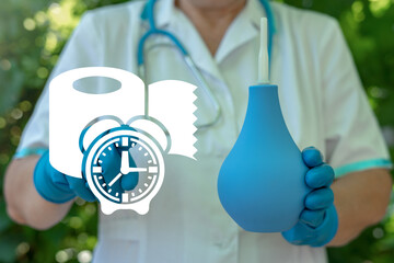 Doctor hold enema and touch toilet paper with alarm clock virtual icon. Constipation Medical...