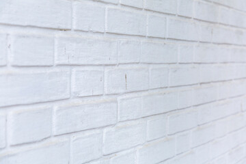 Embossed textured surface of an old wall made of facade bricks and cement
