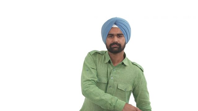 Portrait of furious Indian man showing slap gesture. Aggressive Indian gesture. Isolated on white background
