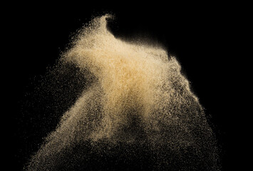 Sand splash explosion isolated on black background ,throwing freeze stop motion object design