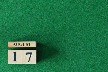 August 17, number cube on snooker table, sport background.