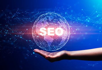 Hand Holding Holographic World Globe With Word Seo, Blue Background