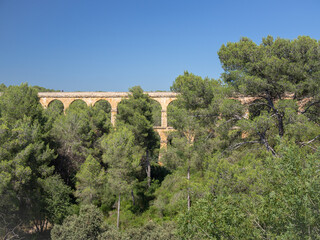 Fototapeta na wymiar Antique Roman aqueduct known as El Pont del Diable (The devil's bridge), Tarragona, Catalonia, Spain.