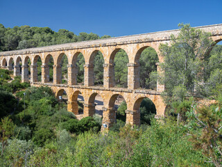 Antique Roman aqueduct known as El Pont del Diable (The devil's bridge), Tarragona, Catalonia, Spain.