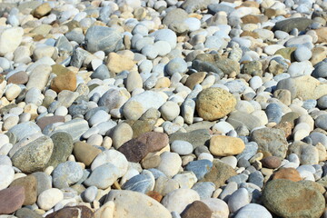 Colorful rounded rocks, pebbles on the river coast