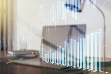 Multi exposure of abstract creative financial graph on modern computer background, forex and investment concept