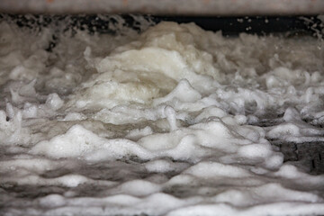 Gold refinery. Modern slag processing machine. Washing for gold separation. Low depth of field.