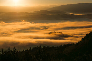 sunrise over the mountains with clouds