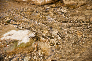 River water flows through the stones