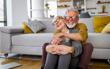 Cheerful senior couple enjoying life and spending time together