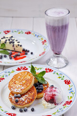 pancakes with ice cream and blueberries