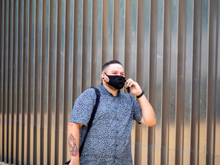 Shot of a man walking  in a medical mask - new normal