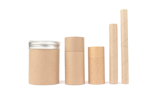 Set of different recyclable paper tubes with paper cap and metal lids, cardboard container for packaging isolated on white background with copyspace, mockup. Recyclable packaging or zero waste concept