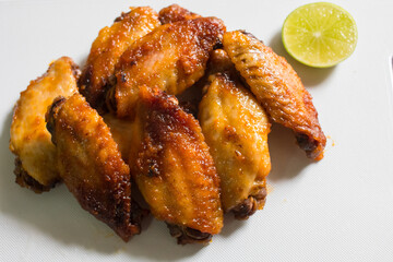 Grilled chicken on white chopping block