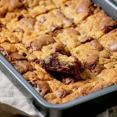 Trend baking Brookies chocolate brownies and cookies homemade cake sliced by squares in baking tray...