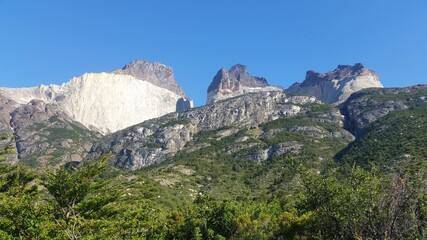Fototapeta premium Mountains, road, Los Cuernos, green area.