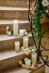 Fototapeta na wymiar Wedding decoration with artificial candles on stairs