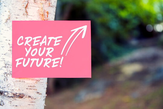 Create your future quote written on paper on a tree in nature. Building your own direction, path, career or achievements in life or business.