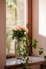 Wedding decoration, a bunch of roses in glass vase
