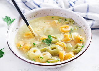 Tortellini in broth, italian traditional dish. Italian pasta.
