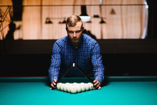 Playing billiard - Close-up shot of a man playing billiard