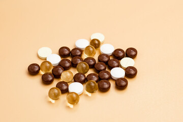 tablets are yellow, brown and white. close up