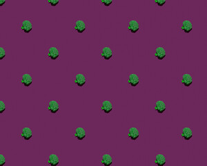Fresh broccoli pattern isolated on a purple background