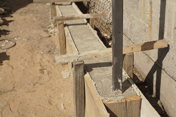 Obraz premium Wooden Formwork Concrete Strip Foundation For A Fence