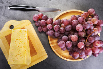 wonderful food fresh red grapes and delicious cheese