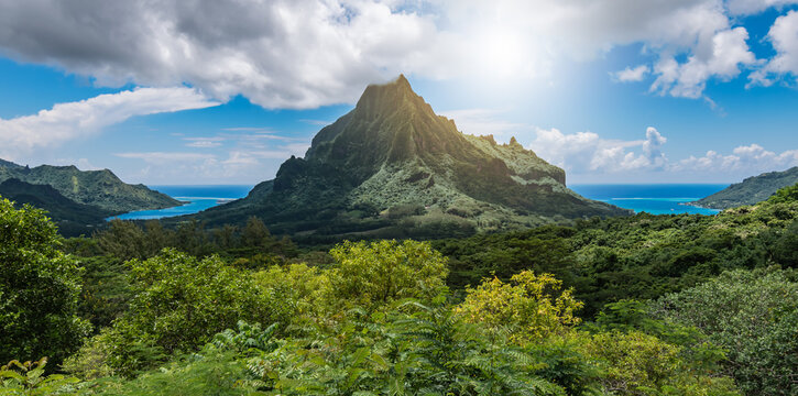 Panoramic mountain peak landscape with Cook's Bay and Opunohu Bay on the tropical Island of Moorea,  French Polynesia.