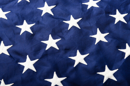 Full frame of white stars on blue of the America United States flag, symbolizing background for use, Veterans or Independence day concept
