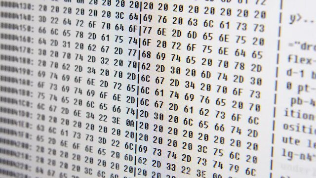 Close up on computer screen binary code on White background.