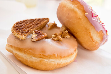 Colorful and delicious homemade donut cakes with strawberry and Belgian waffles taste