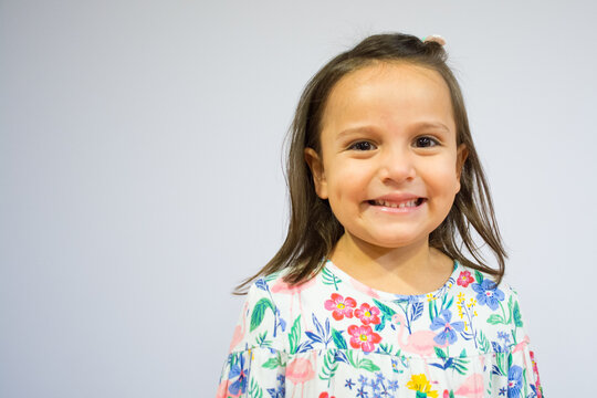 Portrait of a five year old girl making funny faces