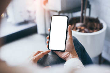 cell phone mockup blank white screen.woman hand holding texting using mobile on desk at coffee shop.background empty space for advertise.work people contact marketing business,technology