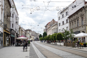 The railroad of public transport - modern tram - crosses the pedestrian center of the historical Miskolc city - a famous Spa resort in the Eastern Hungary