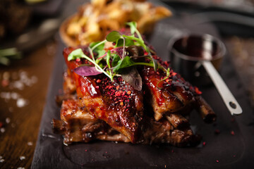 Pork ribs cooked at low temperature. Blackcurrant sauce, parsnip chips with Parmesan cheese....