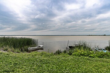 Russia, Rostov, July 2020. A small bay on the lake with fishing boats standing.