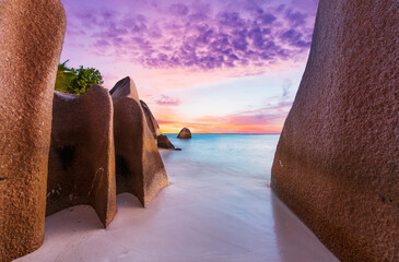 Anse Source d'Argent beach in the Seychelles at sunset - obrazy, fototapety, plakaty