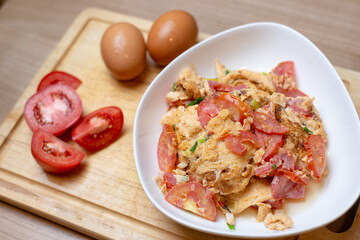 tomato garlic omelet on wooden board