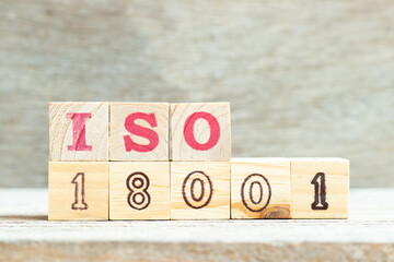 Alphabet letter in word iso 18001 on wood background