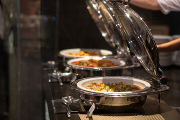 Assorted of food in food warmer on buffet line catering